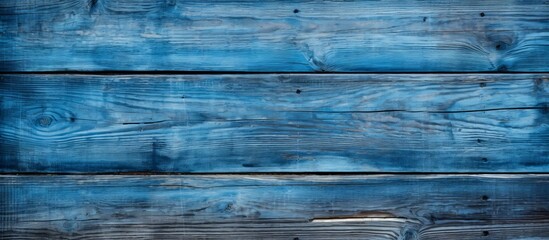A close up of an electric blue wooden wall with a unique pattern and perfect symmetry - obrazy, fototapety, plakaty
