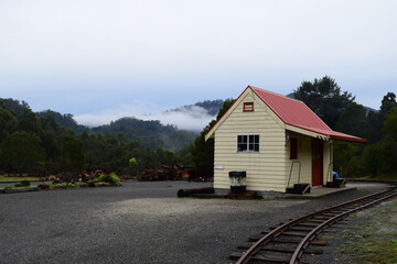Fototapeta na wymiar A small abandoned railway shed in Tullah, Tasmania on a rainy overcast day. 