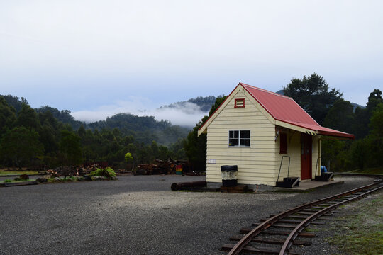 A small abandoned railway shed in Tullah, Tasmania on a rainy overcast day. 