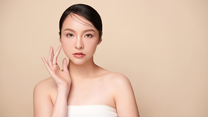 Beautiful young asian woman with clean fresh skin on beige background, Face care, Facial treatment, Cosmetology, beauty and spa, Asian women portrait.