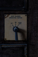 Old electrical power station switch on wall