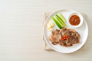 grilled pork neck sliced on plate