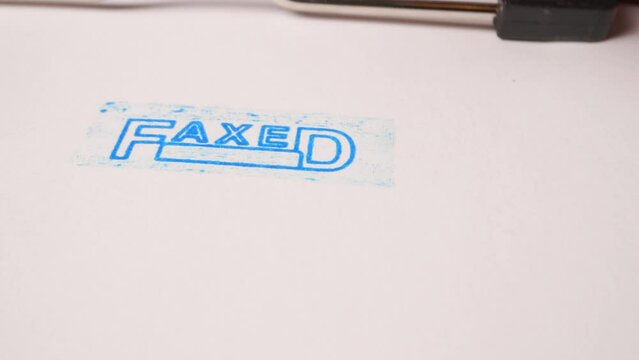 7 Blue faxed stamp inscription on white paper