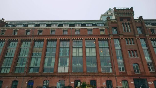 Dutch office building former brickstone warehouse exterior in Amsterdam