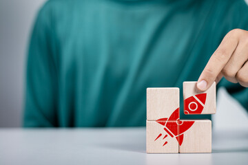 Startup business concept. Strategic planning and business success. Rocket icon on wooden block for...