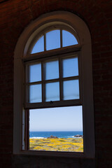 View of the ocean at Point Piedras Blancas viewed through a window