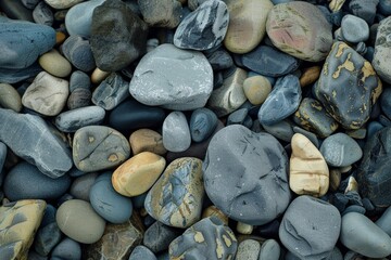 Pebble beach texture, smooth stones in a variety of muted colors