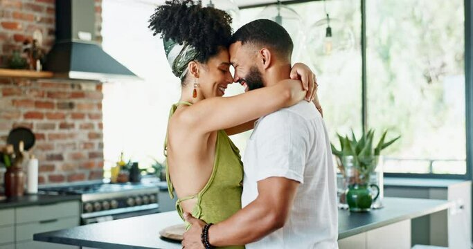 Happy couple, love or romantic for hug in kitchen or bonding together in marriage on weekend. Man, woman and care for commitment in home on honeymoon and embrace to relax on holiday in modern house
