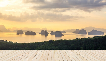 Fototapeta premium Wooden Floor with soft morning light tone sea with numerous islands at Phuket, Thailand