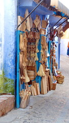 Shop with carved wood items on display in Chefchaouen, Morocco