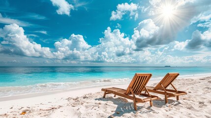Beach chairs on the white sand beach with cloudy blue sky and sun - obrazy, fototapety, plakaty