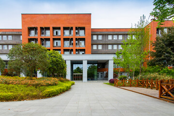 On the university campus, a new teaching building stands high