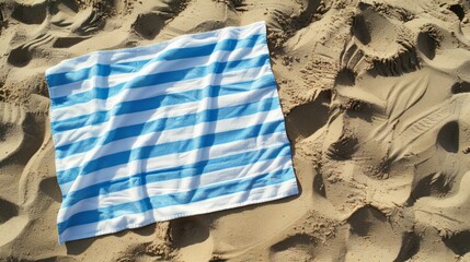 Striped beach towel on sand, aerial view. Space for text