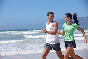 Sunshine, beach and running with couple, fitness and energy with wellness or practice with morning routine. Seaside, summer or man with woman or runner with training or hobby with exercise or workout