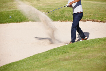 Man, golfer and hands with swing in sand pit for par, stroke or strike on grass field in nature....