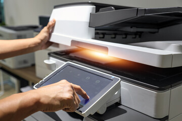 Hand use copier or photocopier or photocopy machine office equipment workplace for scanner or scanning document or printer for printing paperwork hard copy duplicate Xerox service maintenance repair.