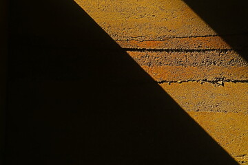 sunshine on the rammed earth wall 