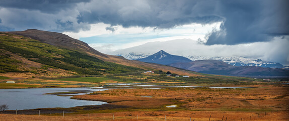 Panoramic view of scenic mountain landscape in Iceland countryside .