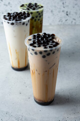 A view of several boba drinks.