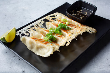 A view of a plate of gyoza.