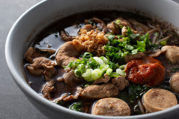 A closeup view of a bowl of boat noodle.