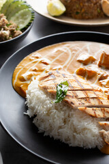 A view of a plate of Thai chicken curry.