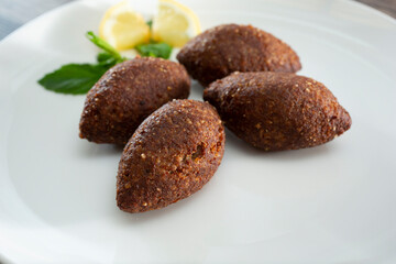 A closeup view of a plate of kibbeh.