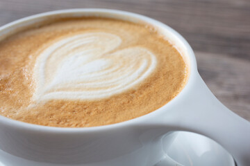 A closeup view of a heart latte art.