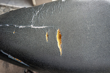 Close Up of Torn Leather Motorcycle Seat Showing Inner Foam
