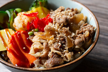 A closeup view of a gyu-don bowl.