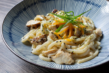 A view of a bowl of curry udon.