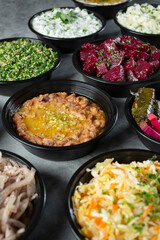 A view of a several Mediterranean side dishes.