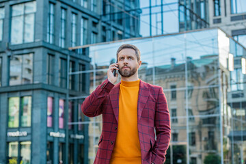 Fototapeta premium businessman call on cellphone outside, communication. photo of businessman call