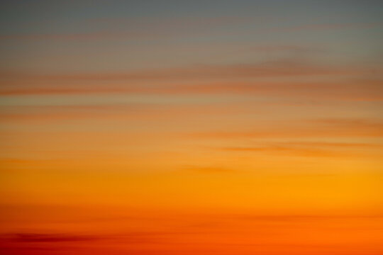 Fototapeta Sky gradient from blue to orange sunset