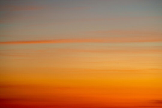 Fototapeta Sky gradient from blue to orange sunset