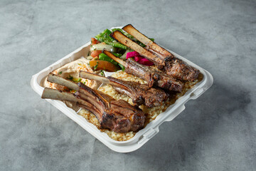 A view of a lamb chop entree.