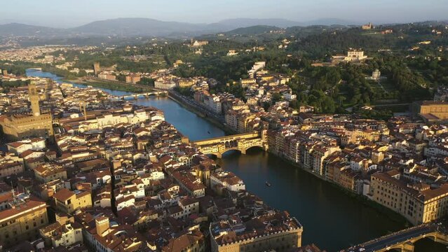Bridges and Arno river, sunny, summer morning in Florence, Italy - Aerial view