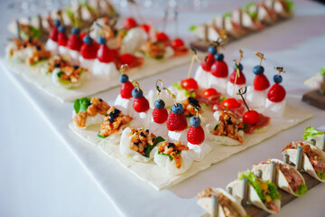 Buffet. Various canapes on banquet trays. Catering services.