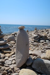 Fototapeta na wymiar cairn, stone balance, pyramid of stones on the beach