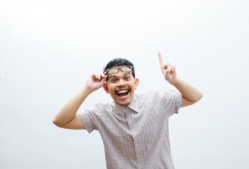 Fototapeta premium an asian man smiles and points to something with his hand