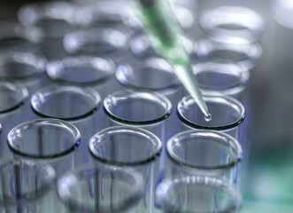 Biotechnology, Pipetting samples into test tubes for analysis