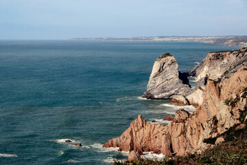 cliff in blue ocean at Cape Roca coastline in Portugal  - 771250240