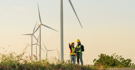 Engineers are working with wind turbines, Green ecological power energy generation, and sustainable windmill field farms. Alternative renewable energy for clean energy concept. - 771250887