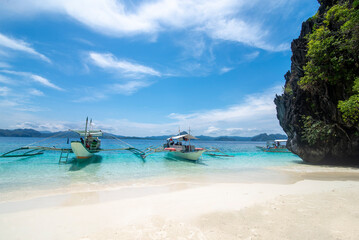 Wooden boats on the shore of a tropical beach