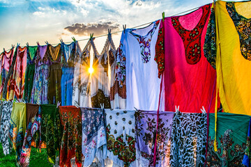 colorful clothes hanging in the market