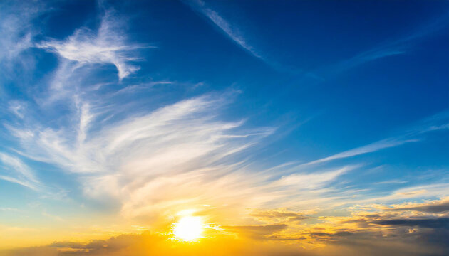 Beautiful blue summer sky with bright sun at sunset as a background