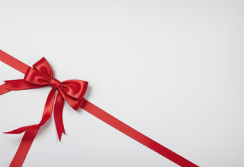 Beautiful red ribbon tied in bow isolated on white colorful background - obrazy, fototapety, plakaty