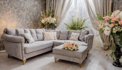Soft gray fabric sofa with cushions and floral decor