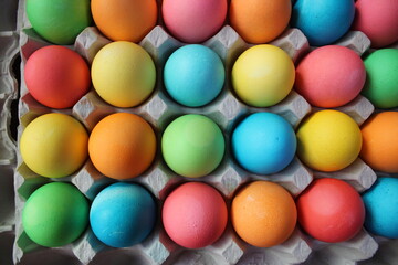 Fototapeta na wymiar colorful eggs in carton