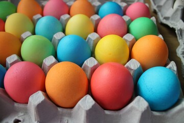 colorful eggs in a carton